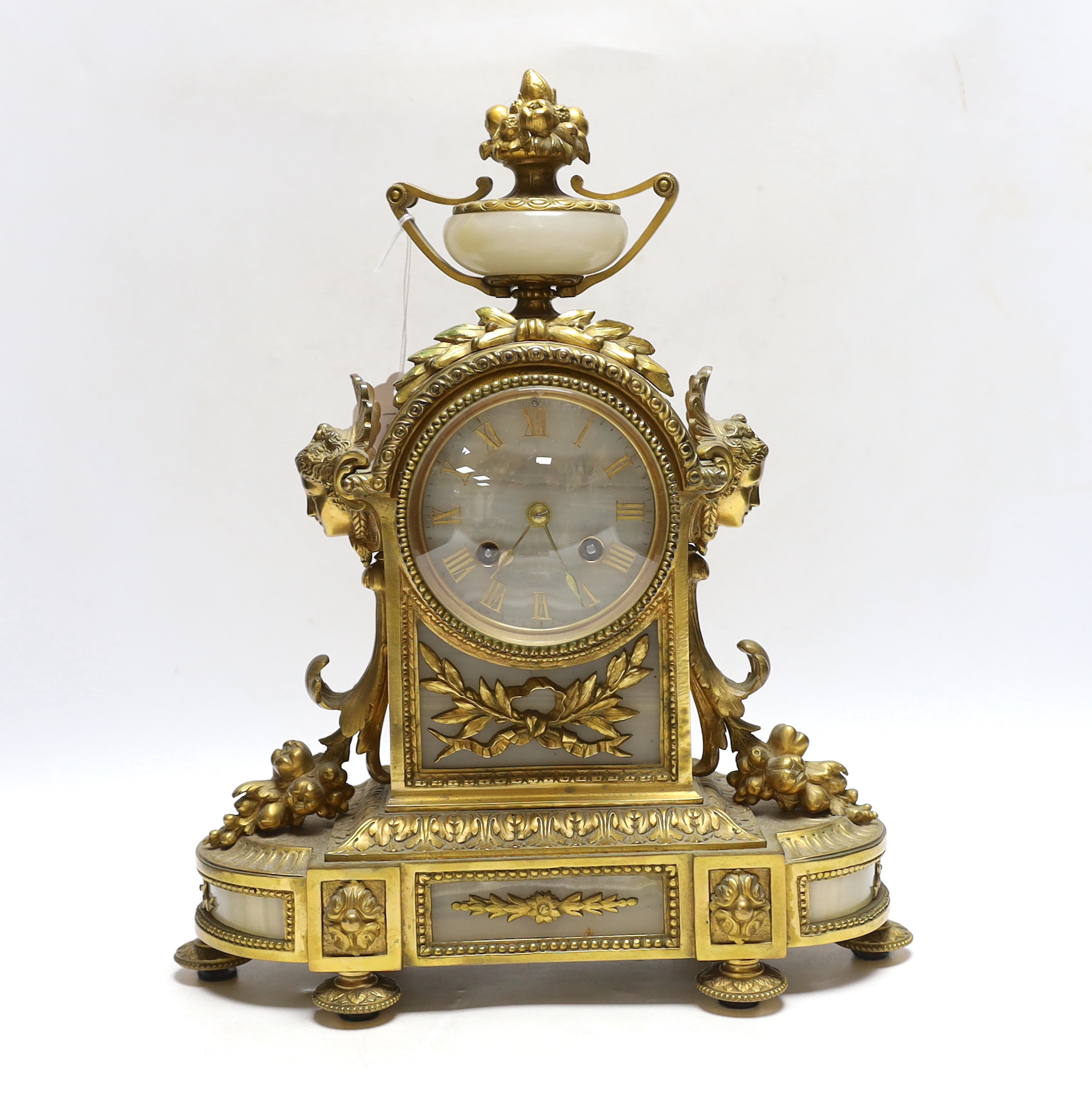 A late 19th century French gilt metal and alabaster mantel clock, 34cm